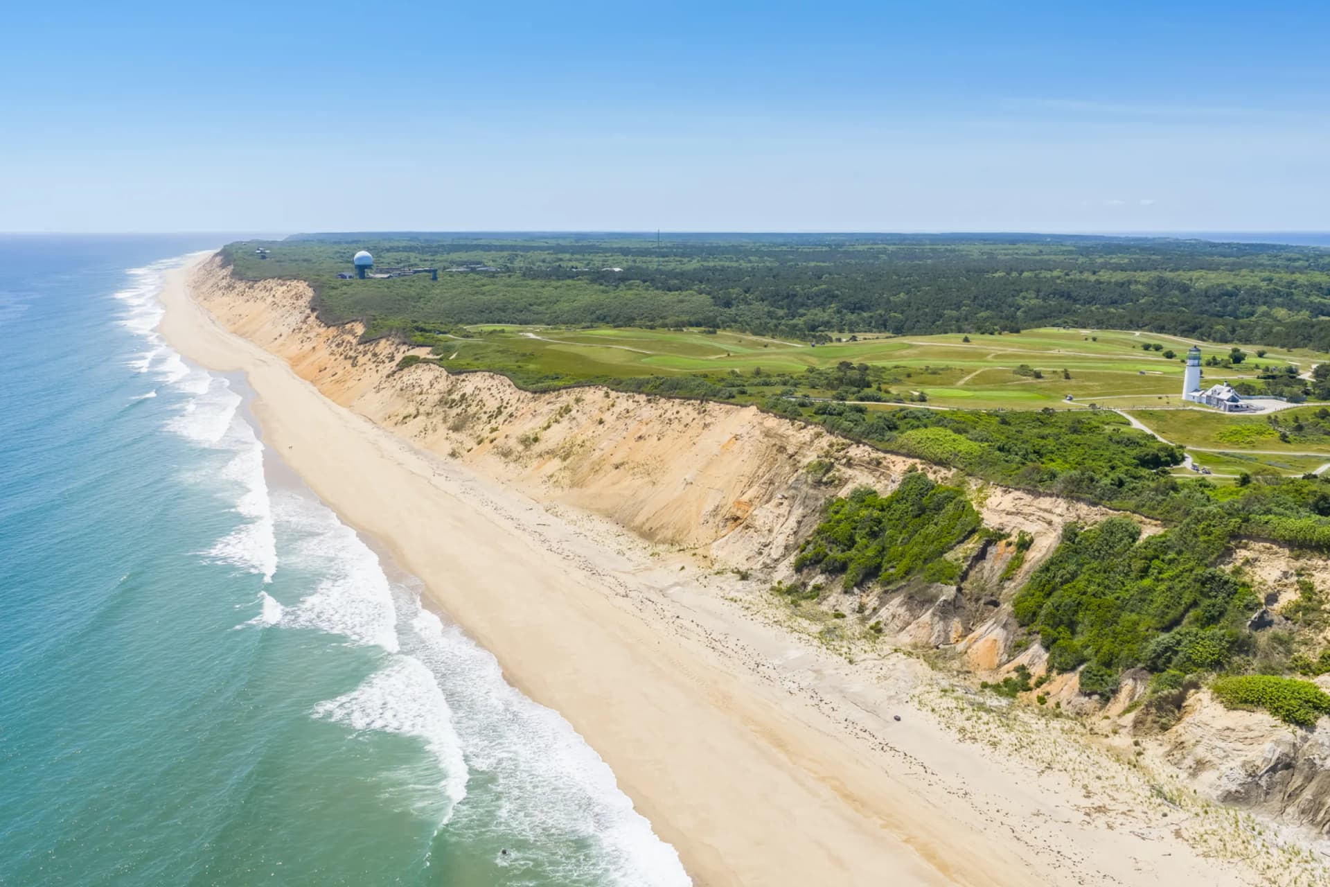 Aerial view of Truro coastline with dramatic ocean cliffs and sandy beach